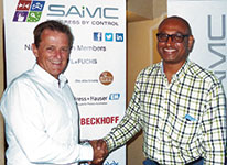 Chairman Howard Lister (left) is seen thanking Professor Ralph Naidoo after his presentation.